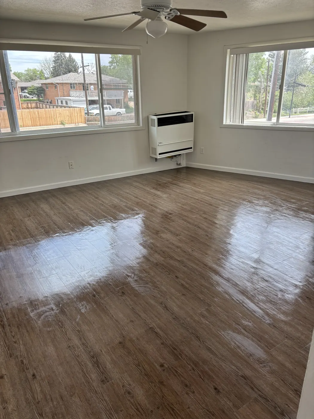 Freshly cleaned living room with glossy wood-look floors